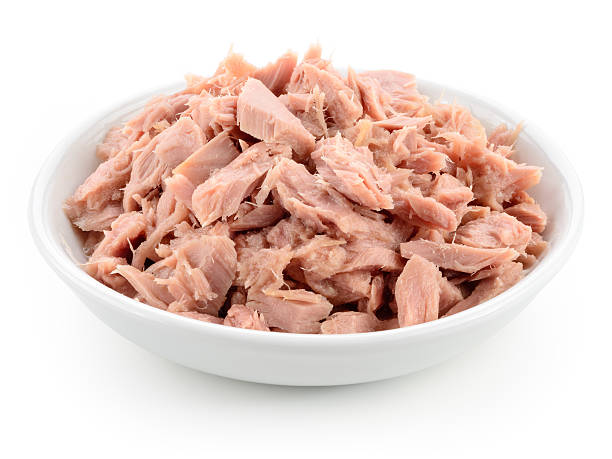 Tuna. Canned fish isolated on white. Macro.